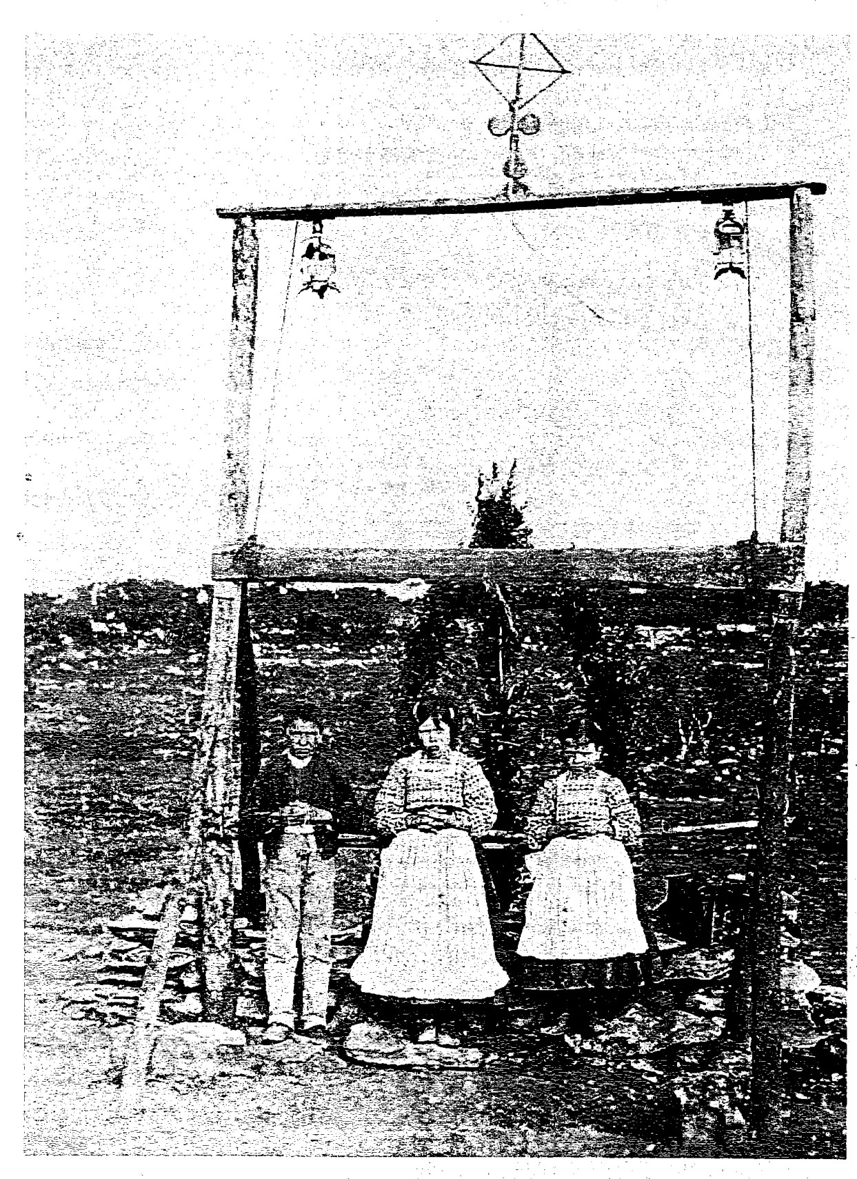 The three seers beneath the rustic arch at the Cova da Iria, 1917: Book scan