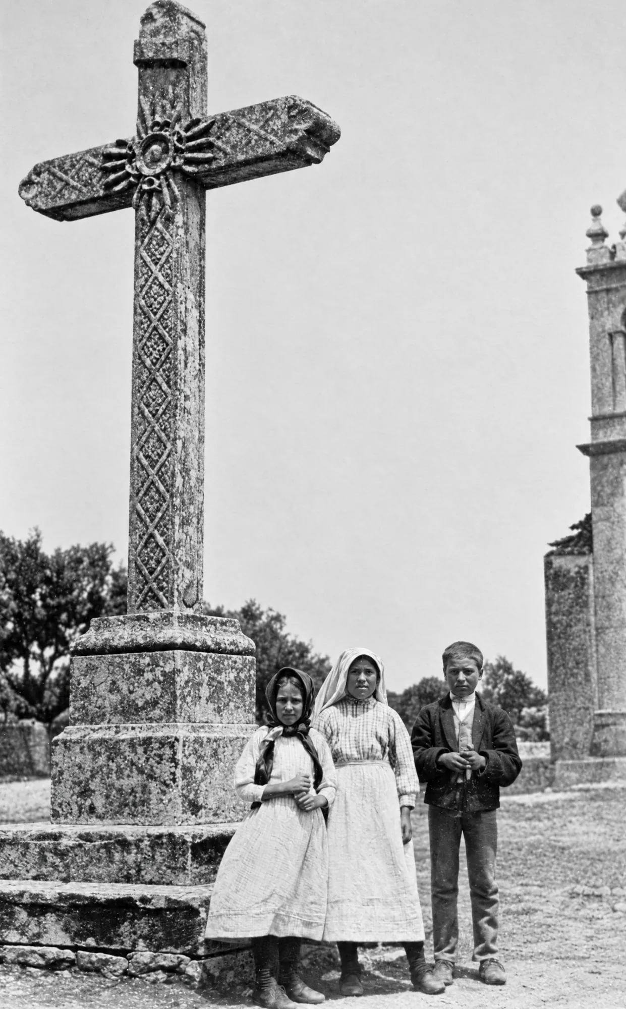 The three seers by the churchyard cross of Fátima parish church, 13 July 1917: Restored (AI)