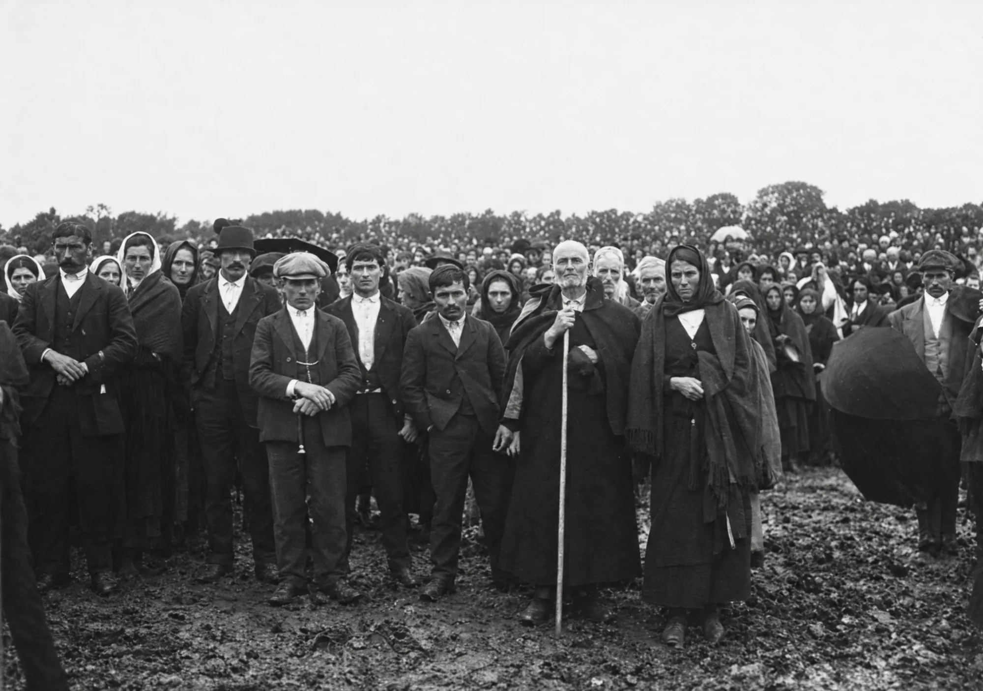 Group standing beside a blind man, Cova da Iria, 13 October 1917: Restored (AI)