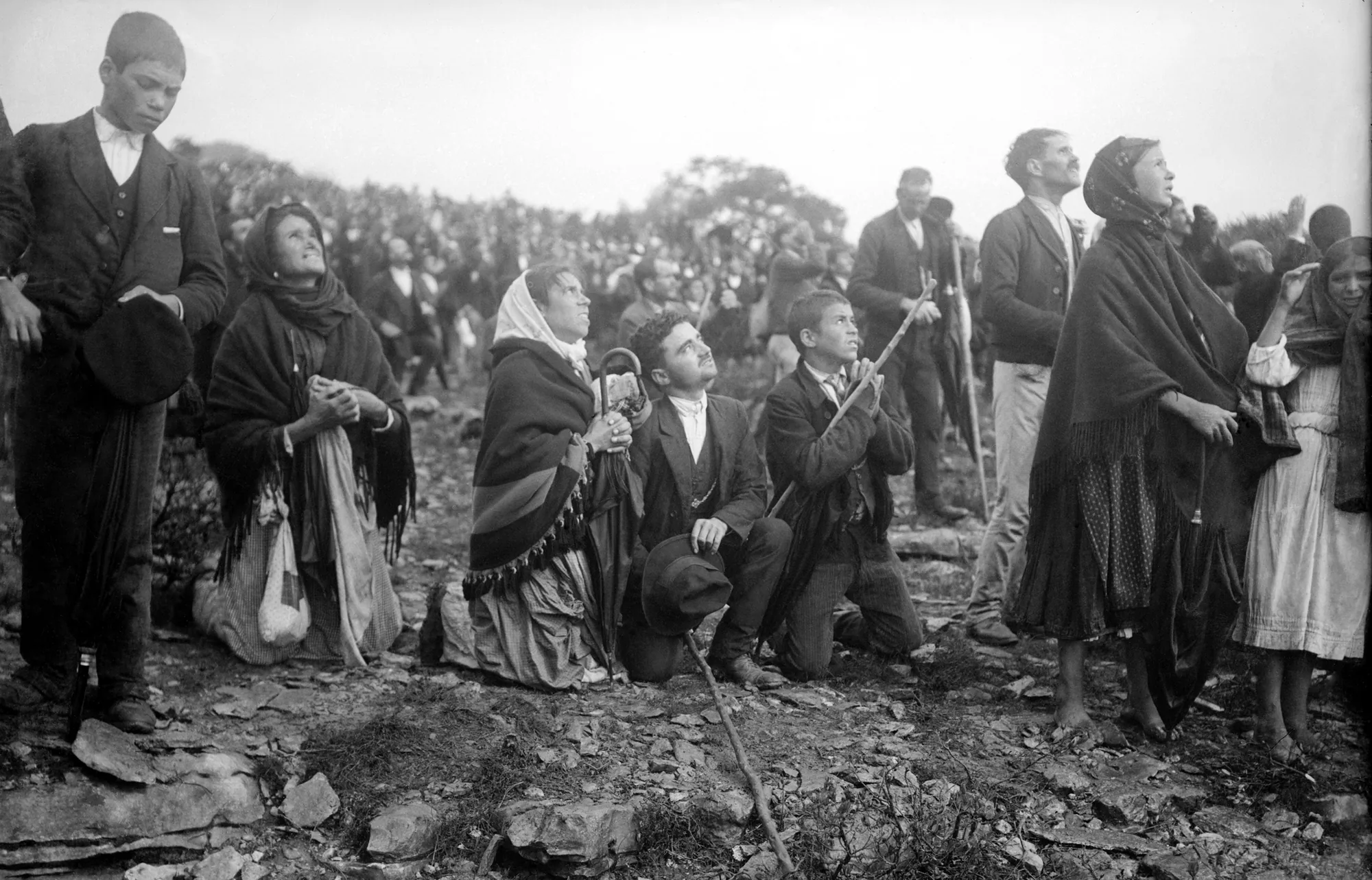 Crowd kneeling and praying during the solar phenomenon, 13 October 1917: Archive print