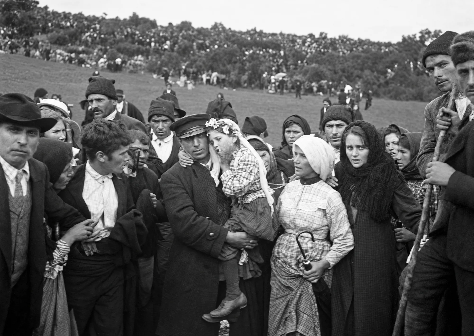 Jacinta, crying, is carried in a man's arms, 13 October 1917: Restored (AI)
